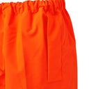 Close-up of high visibility orange work trousers with elastic waistband and side pocket