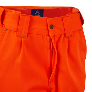 Close-up of high-visibility orange work trousers with belt loops and zip fly