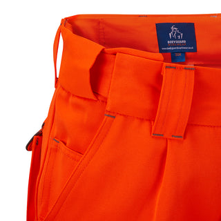 Close-up of orange work trousers with wide belt loops and reinforced stitching