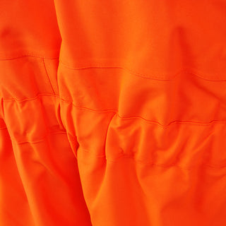 Close-up of orange hi-vis workwear fabric with stitched seams, weather-resistant material