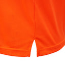 Close-up of orange hi-vis workwear shirt hem with side vent and mesh fabric texture